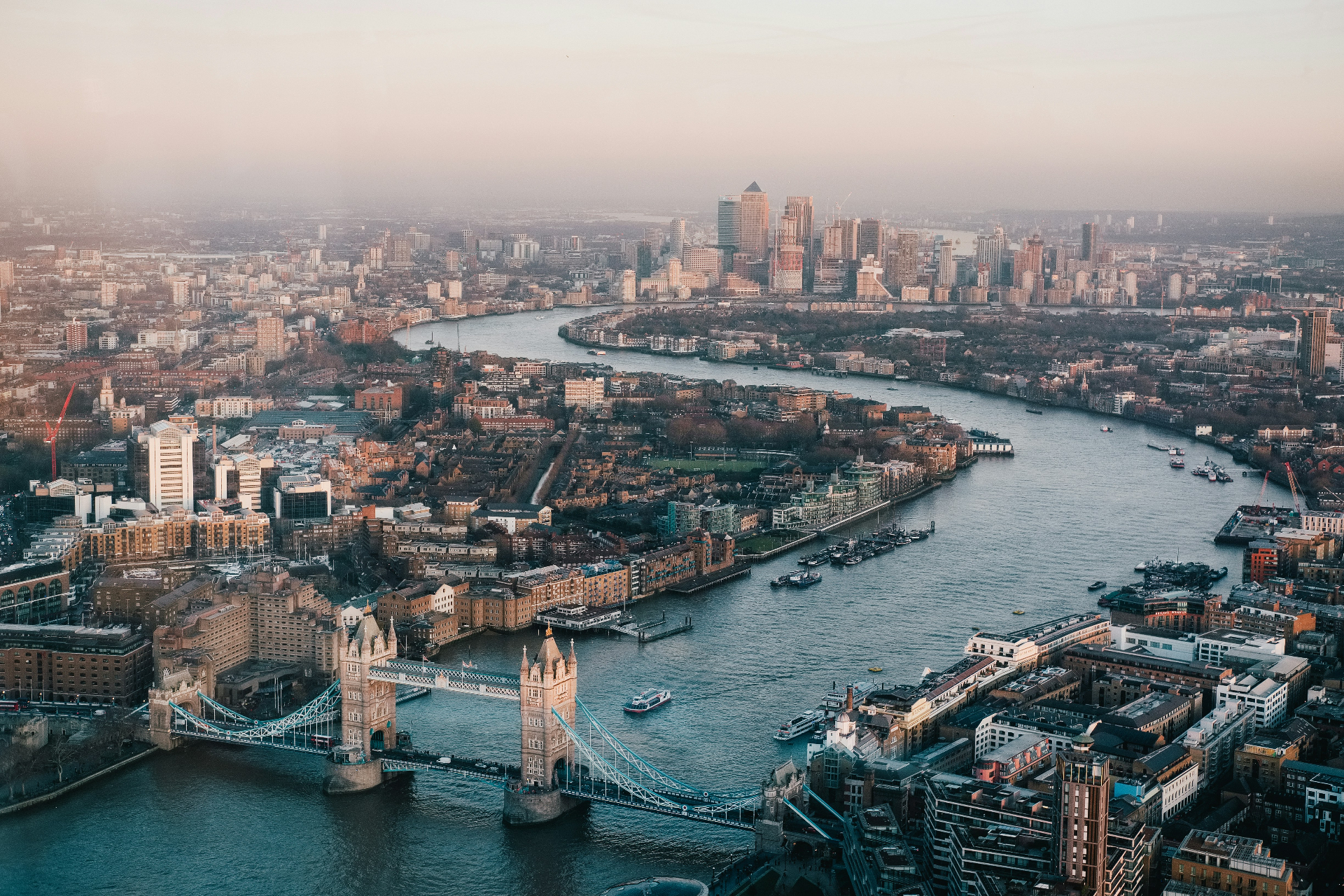 Aerial view of London showing Tower Bridge, the River Thames, and the city's iconic skyline